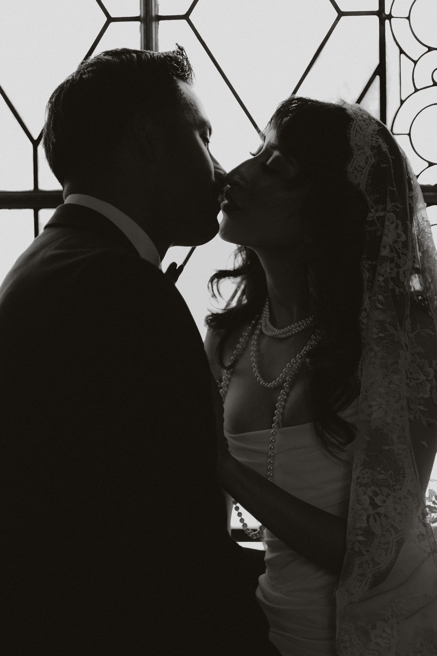 A series of silhouetted wedding photos showing tender moments between newlyweds.