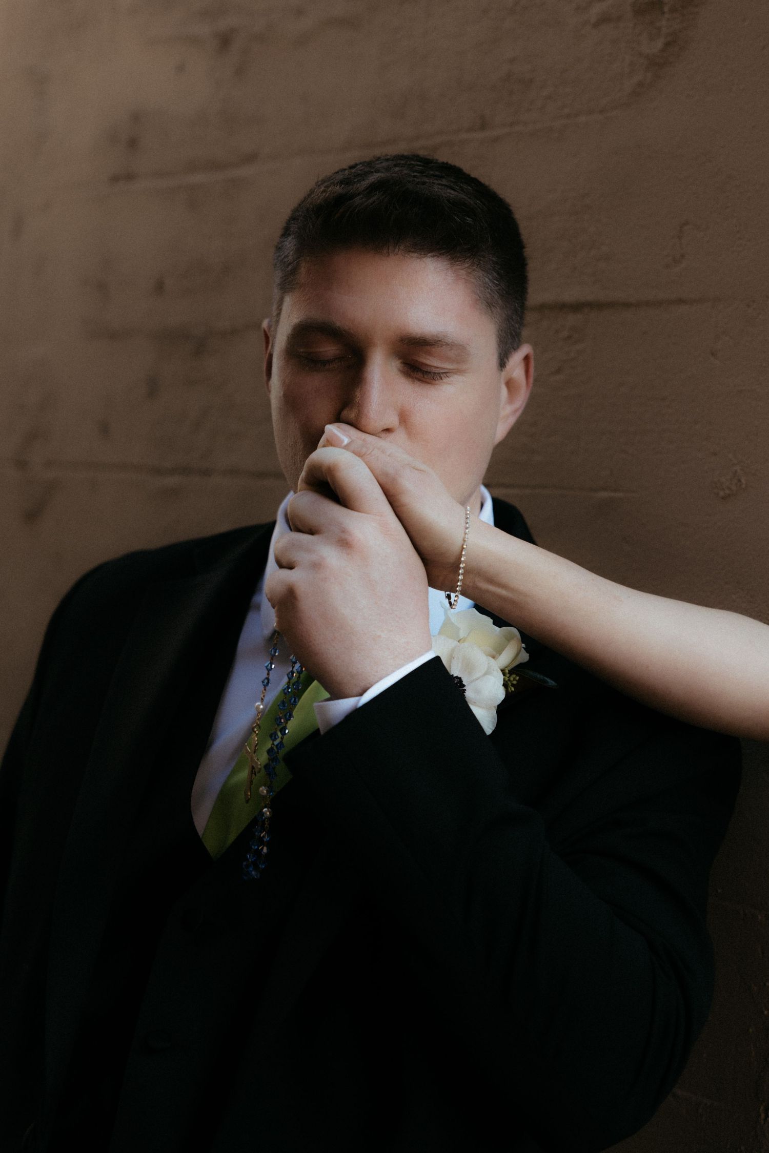 A sequence of emotional first look photos showing the groom's touching reaction during a wedding moment.