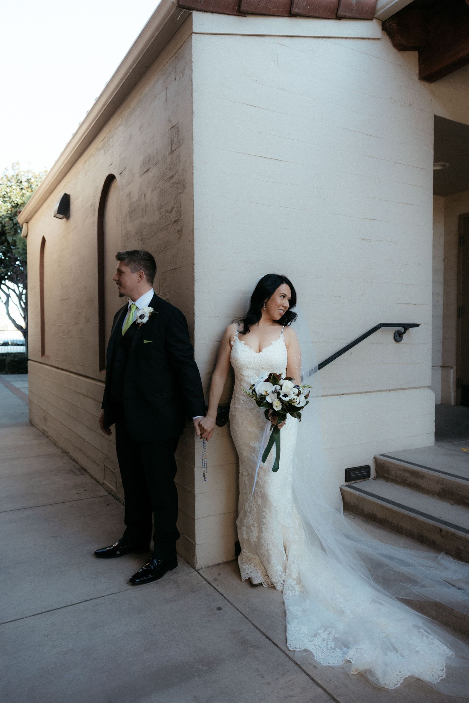 A series of wedding photos showing a couple taking creative shots along a white wall and corridor.