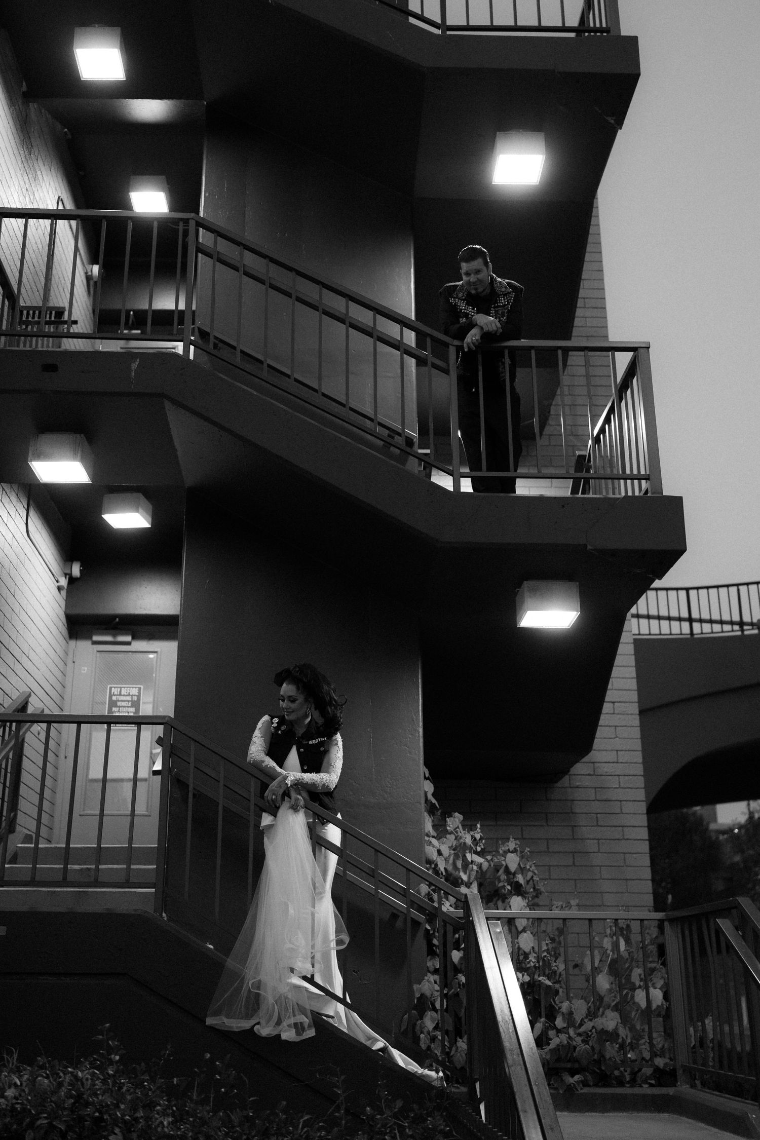 Wedding photo sequence on a staircase with dramatic lighting and angles.