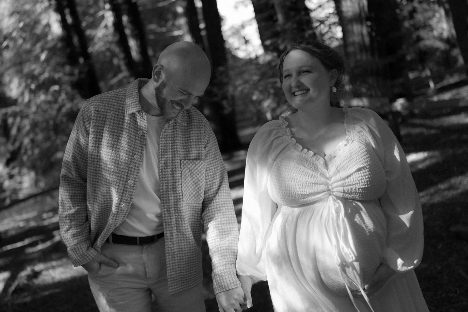 A series of black and white photos showing a couple in vintage clothing walking together in a garden setting.