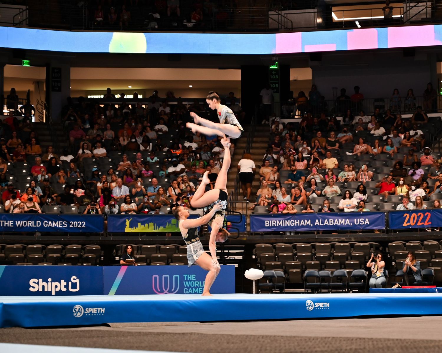 Acrobatic gymnasts perform a balance routine at The World Games 2022 in Birmingham, Alabama, USA.