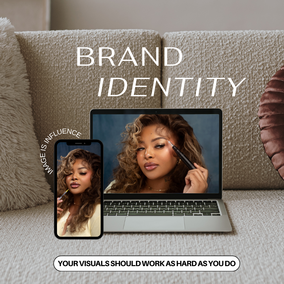 Brand identity development displayed across multiple laptop monitors showing design mockups on a gray surface.
