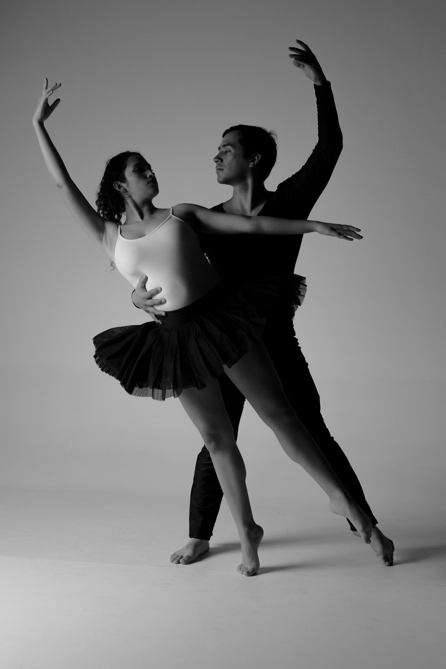 Black and white dance photography showing graceful movement and flowing forms.