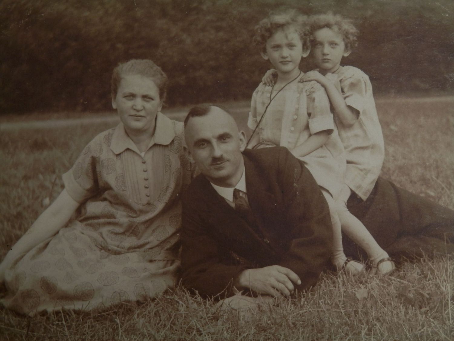 Family relaxing in a field