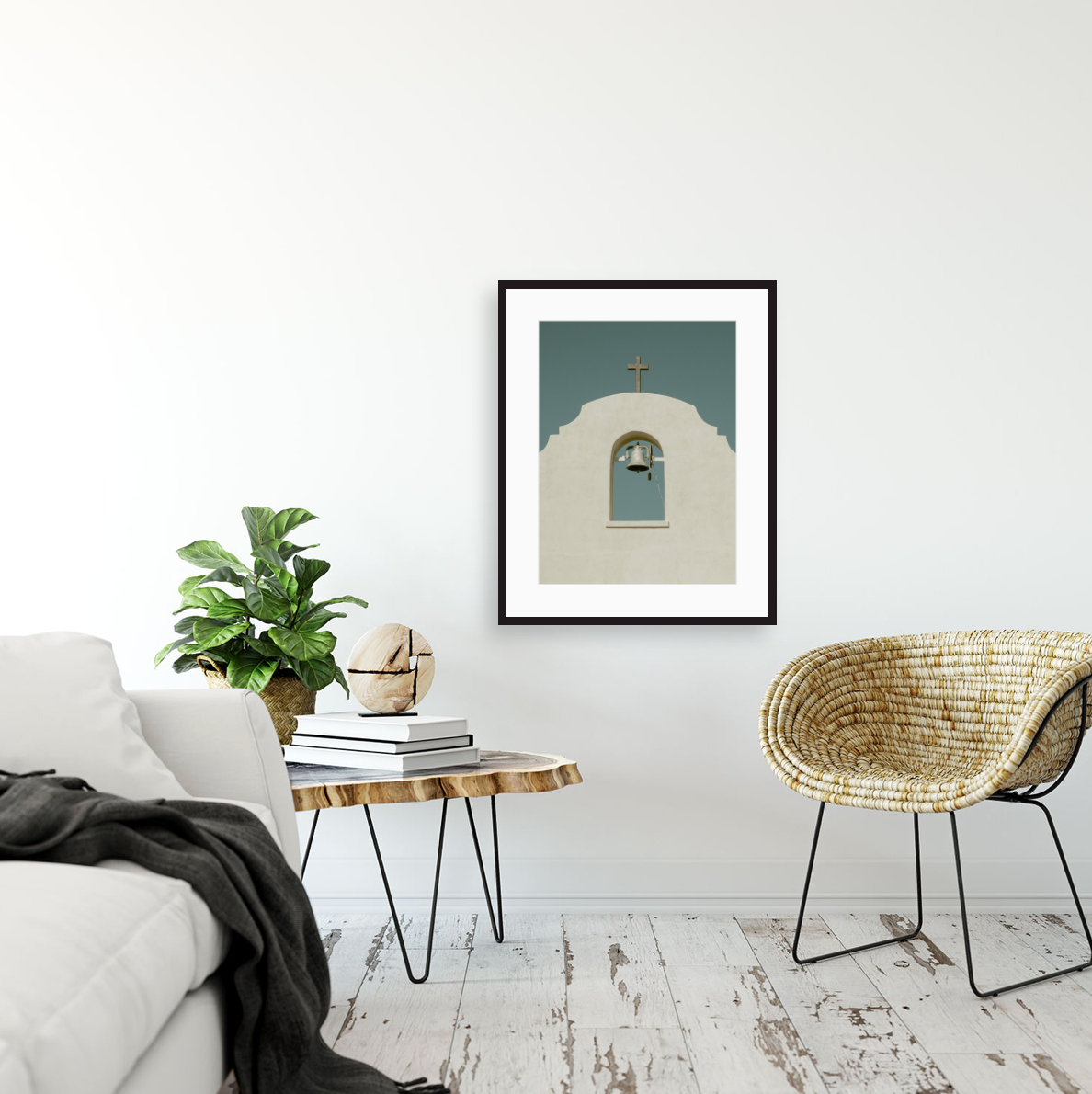 Modern minimalist interior with a framed architectural print, houseplant, and woven accent chair.