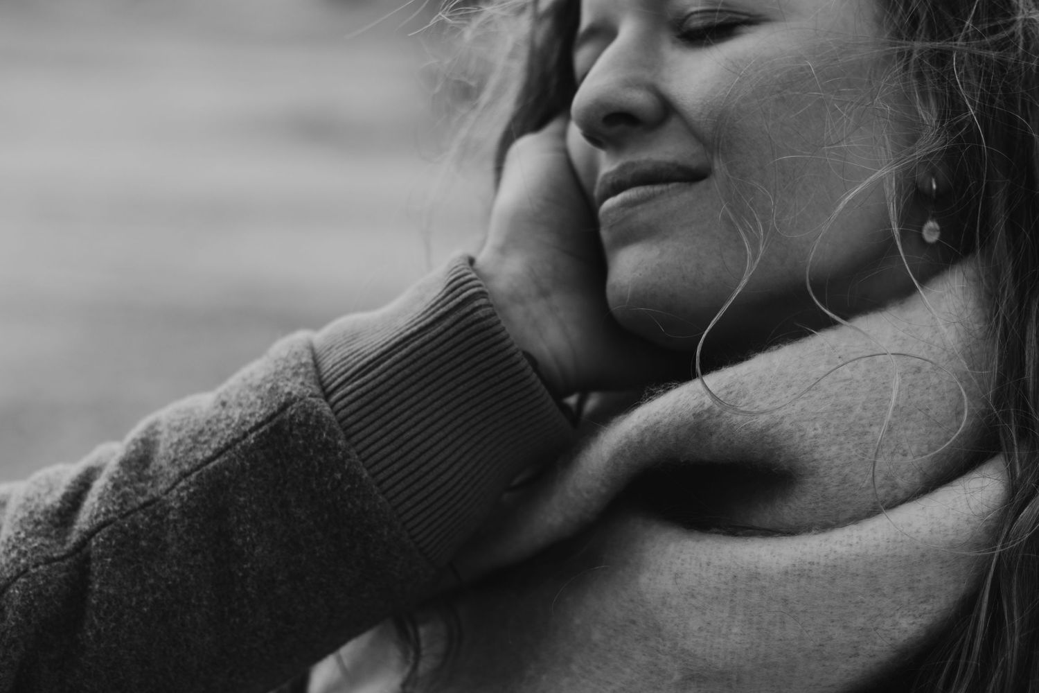 A series of black and white photos showing intimate romantic moments between two people.