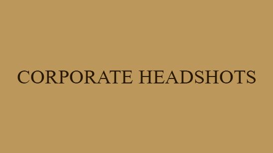 Gold background with elegant dark text reading Corporate Headshots, ideal for professional photography services.