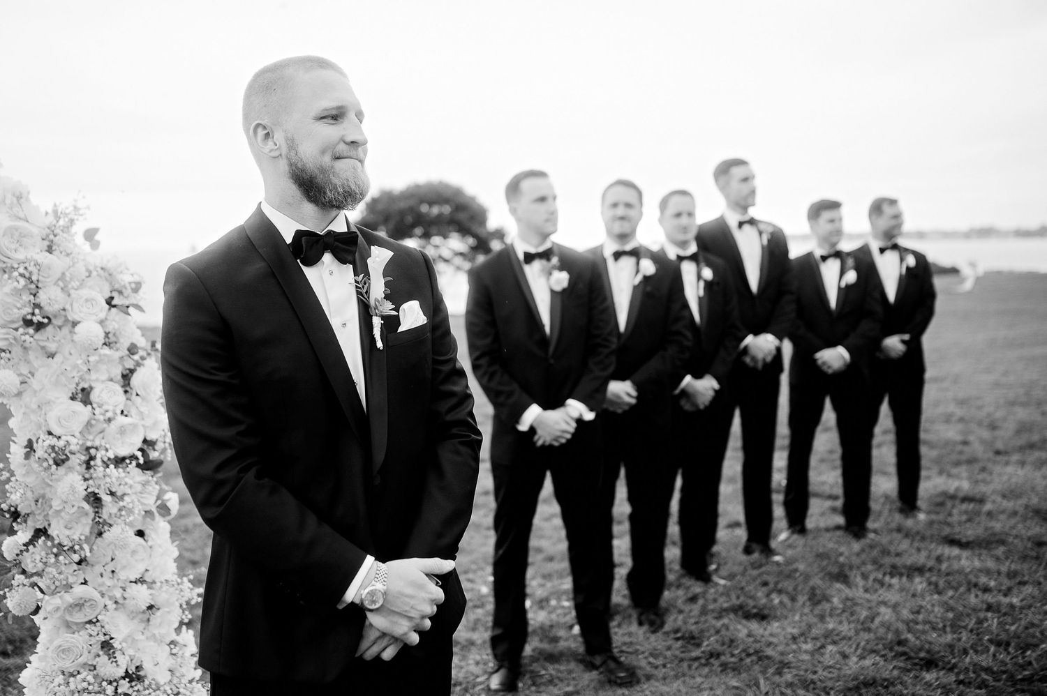 Groom and groomsmen portrait captured in black and white with a classic and timeless aesthetic
