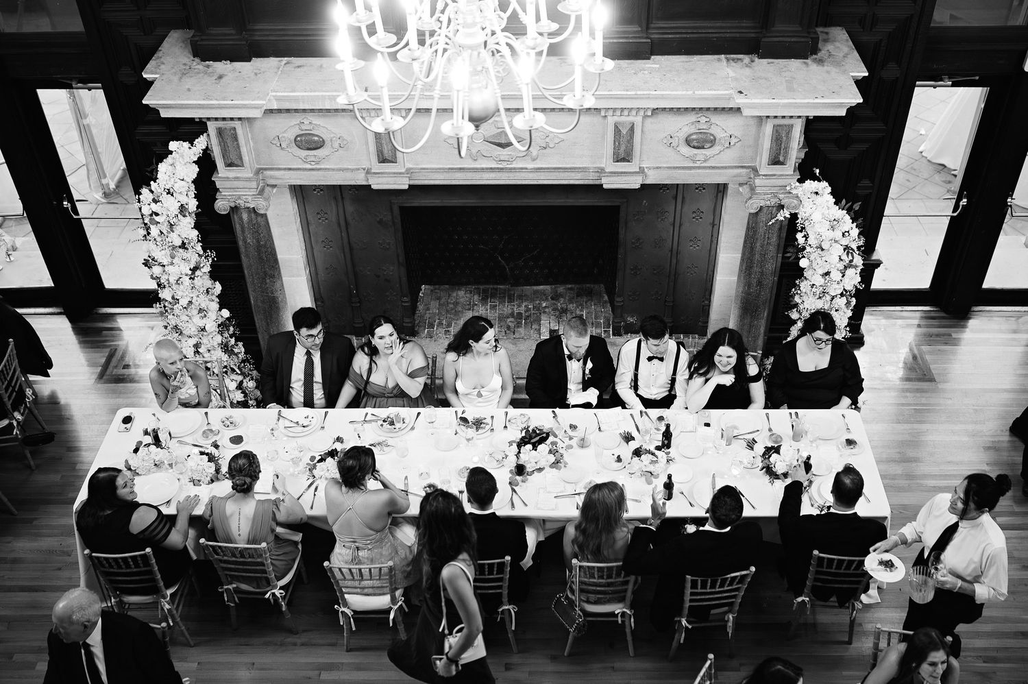 Elegant wedding reception captured in black and white with a timeless and editorial perspective