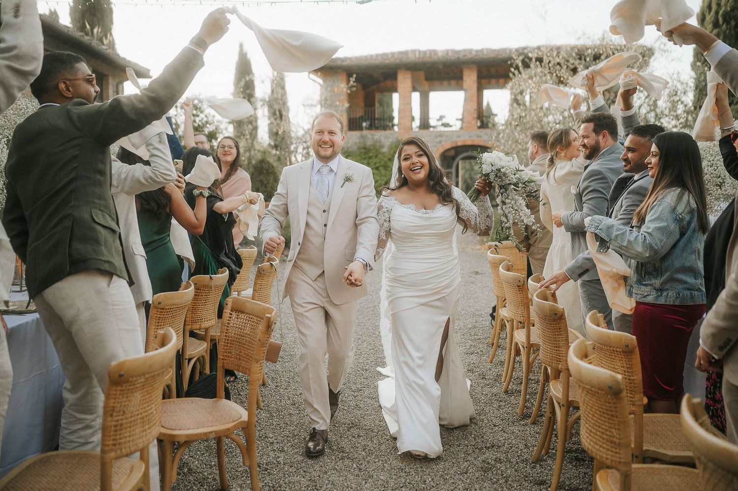 Bride and groom walking after ceremony during Tuscany wedding