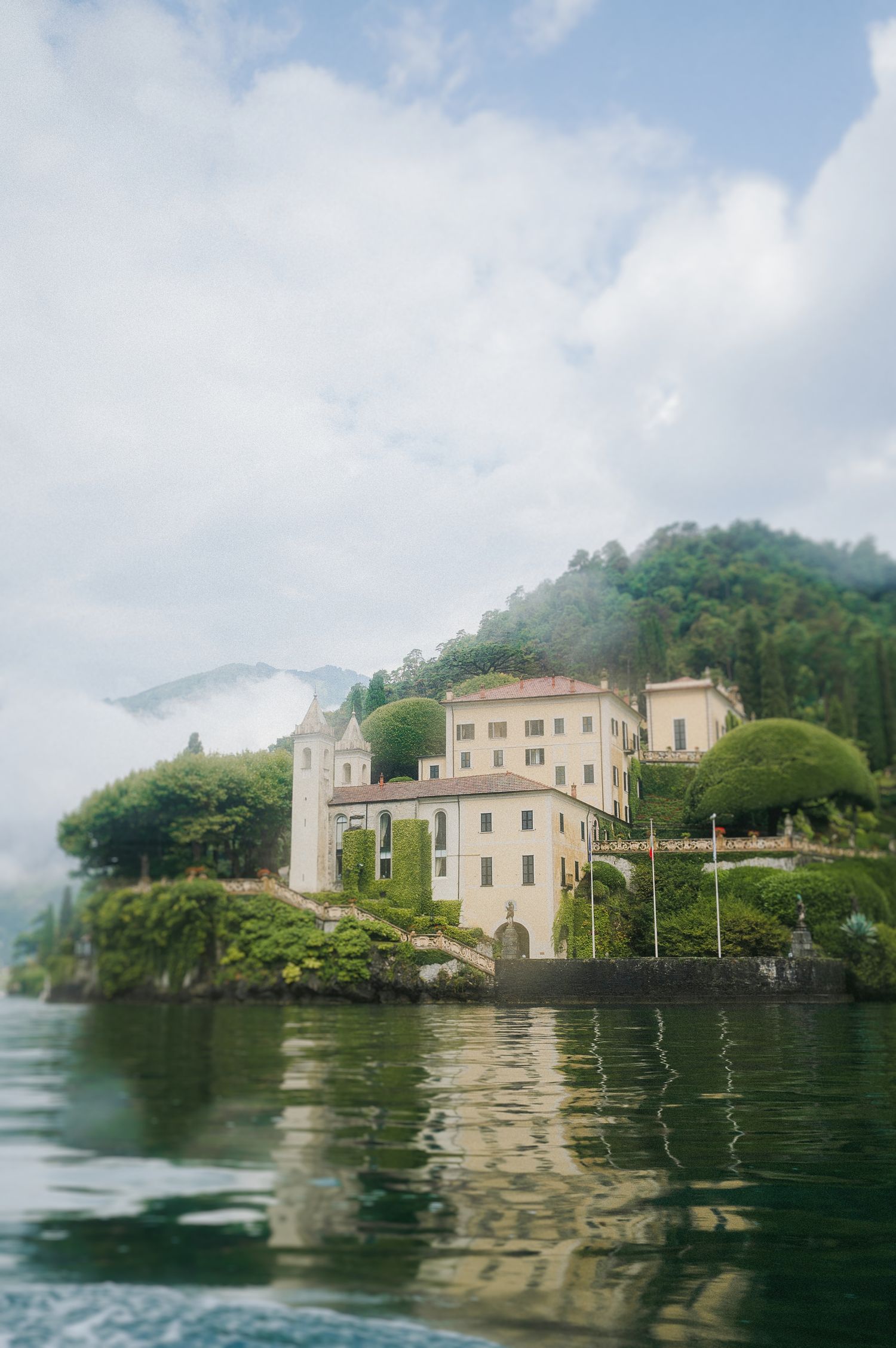 Iconic lakeside view of Villa del Balbianello photographed on Lake Como for a luxury destination wedding