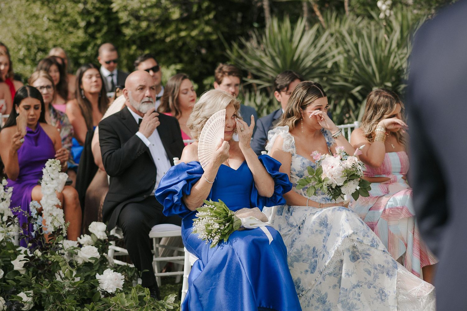 Wedding guests reacting during outdoor Lake Como wedding ceremony