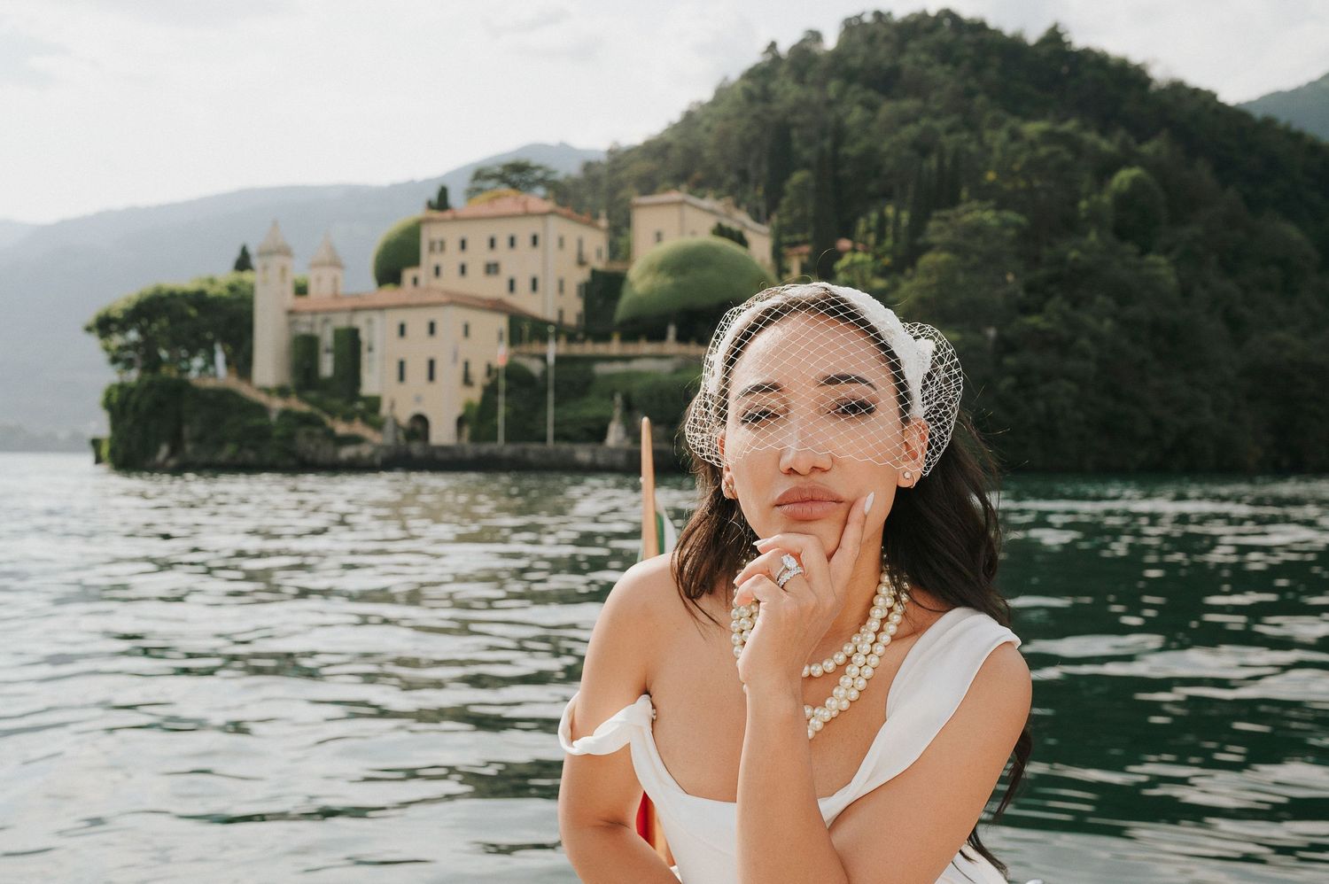 Intimate bridal portrait with Villa del Balbianello in the background on Lake Como