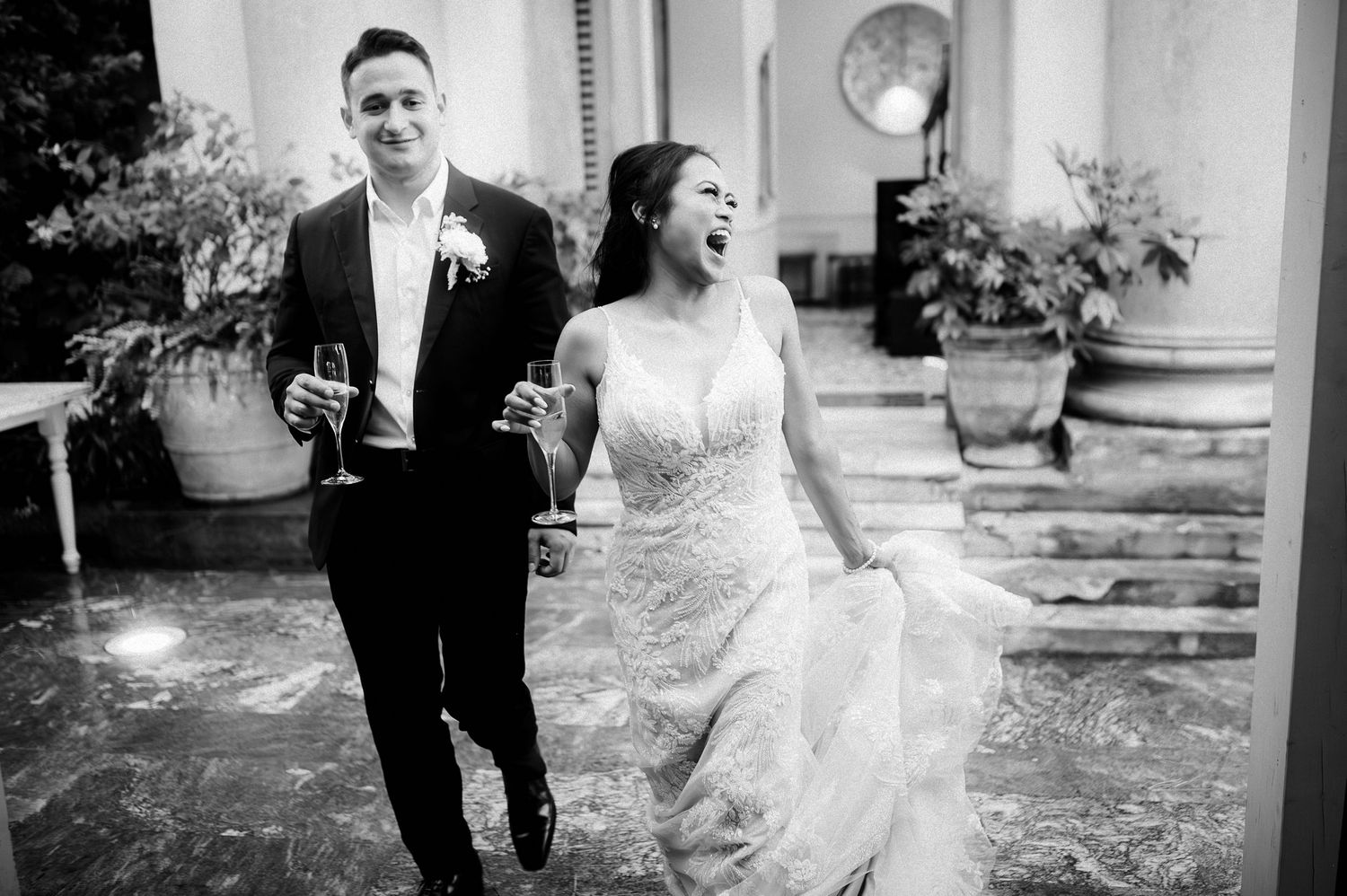 Black and white couple portrait from a Lake Como wedding, capturing movement and natural connection