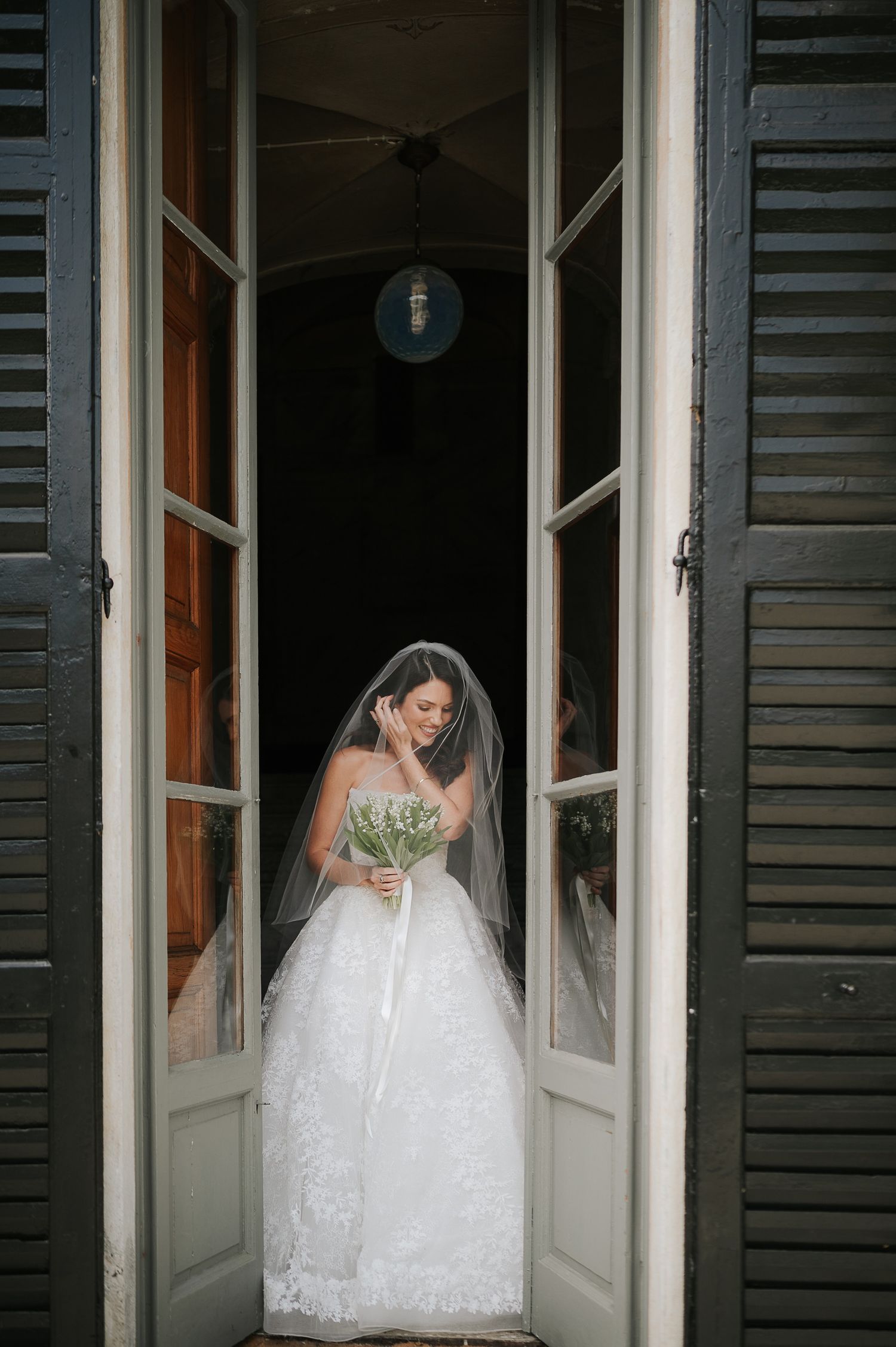 Elegant bridal portrait framed by historic architecture during a Lake Como destination wedding