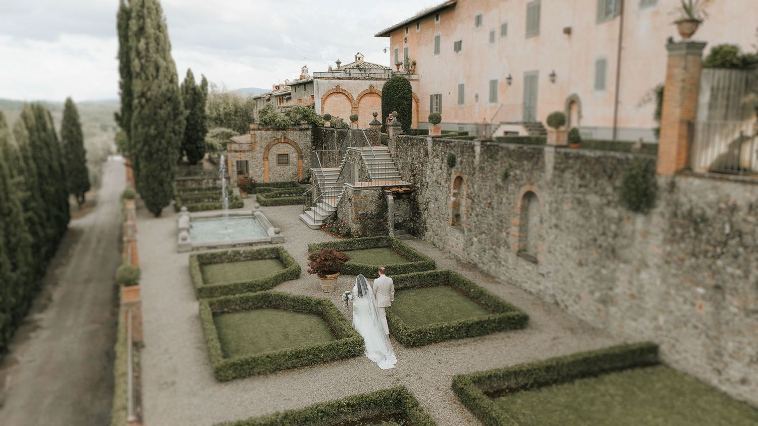 Wedding portrait set in a historic Tuscan garden, captured with a timeless and editorial perspective