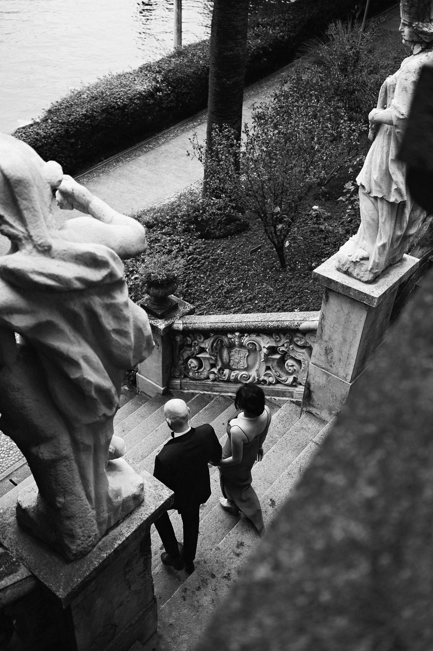 Black and white wedding moment captured on historic architecture during a Lake Como destination wedding