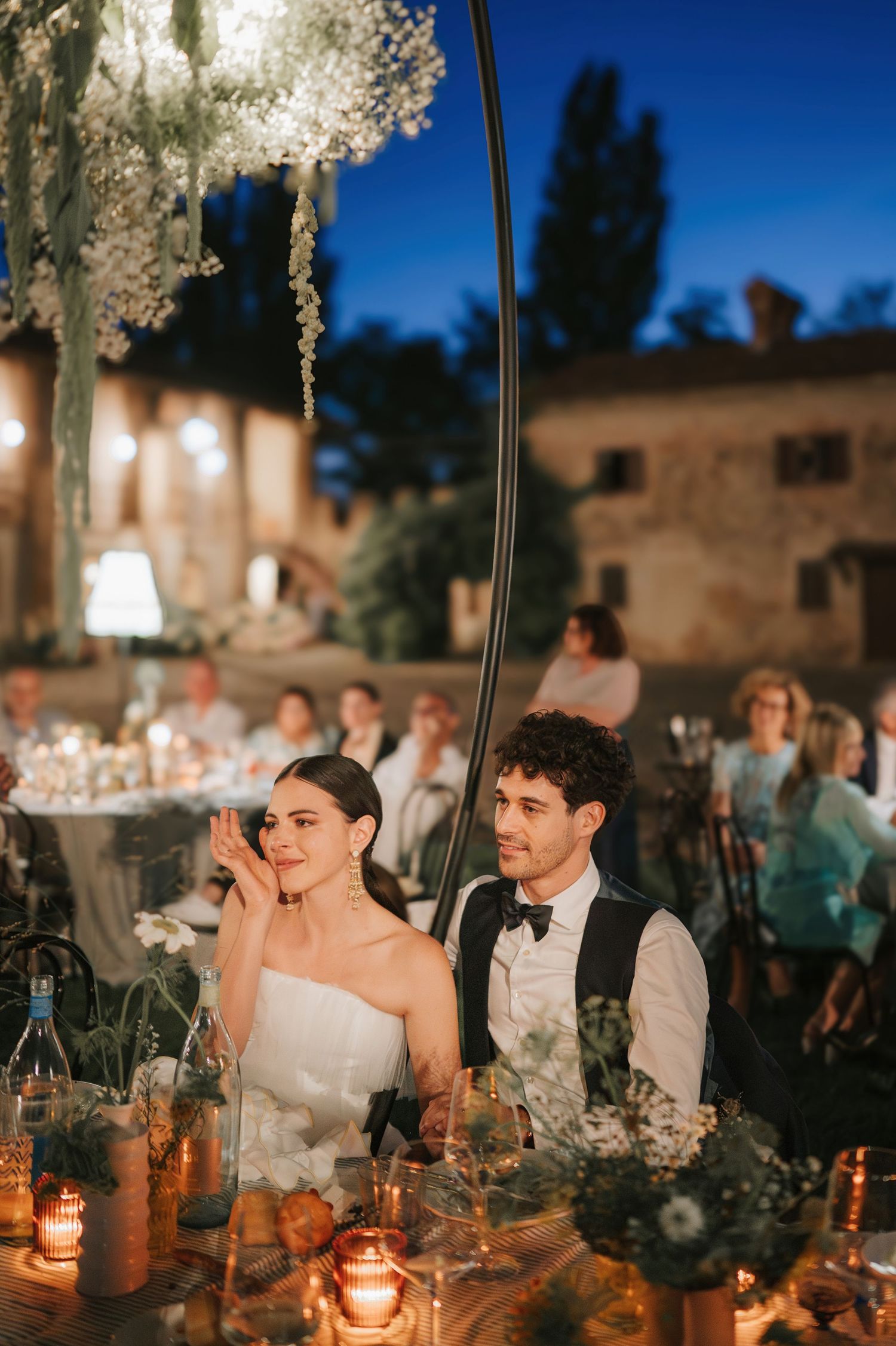 Intimate outdoor wedding dinner under the stars during a luxury wedding in Tuscany