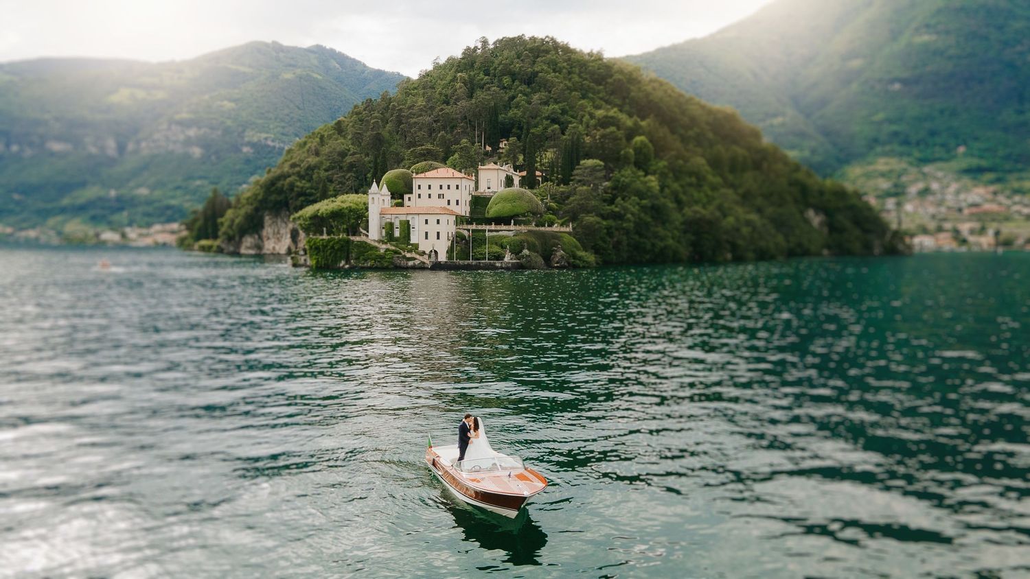 Scenic view of a luxury wedding on Lake Como, Italy, captured with an editorial and atmospheric perspective
