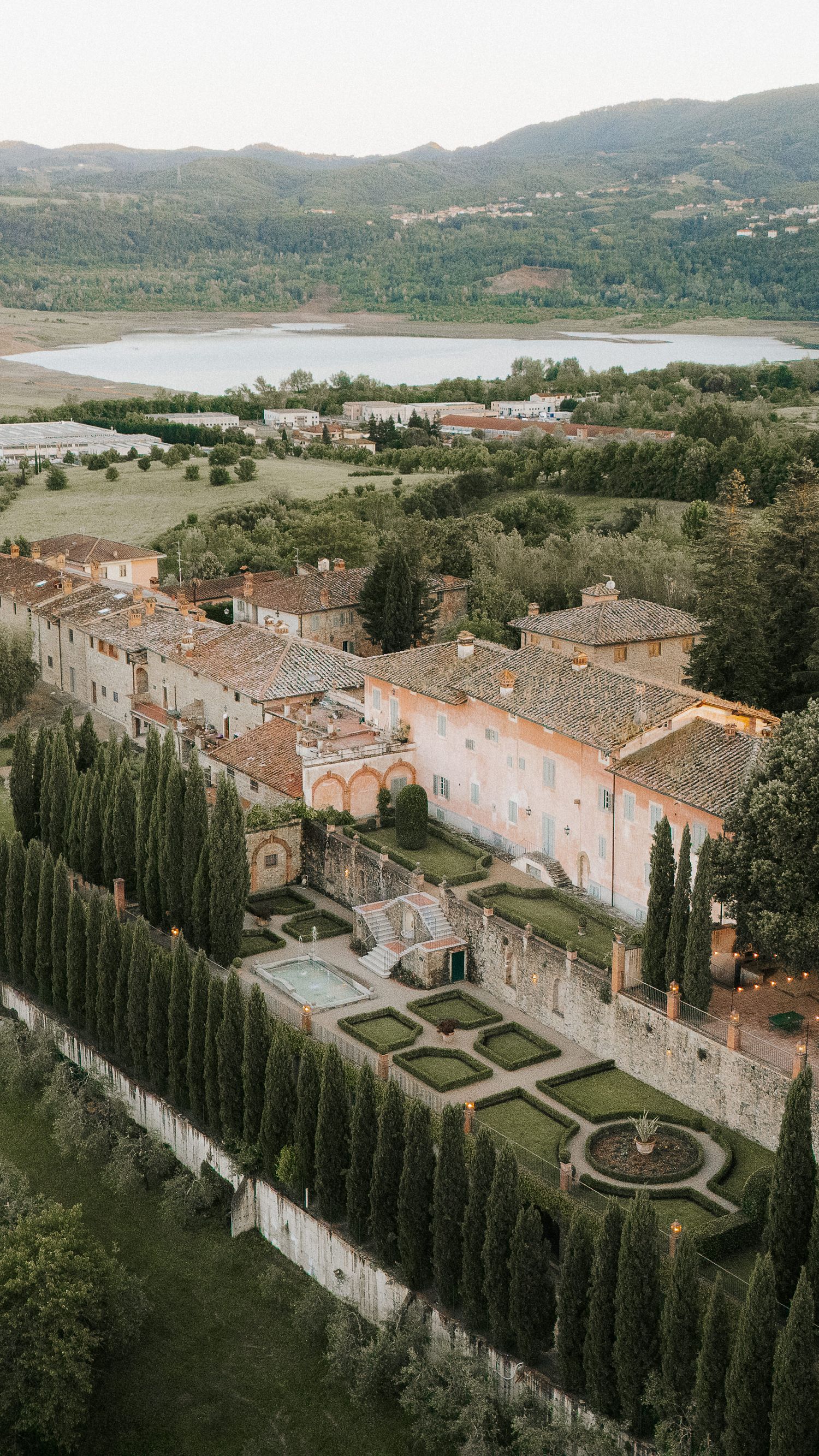Italian wedding destination overlooking the countryside, photographed during a refined welcome celebration