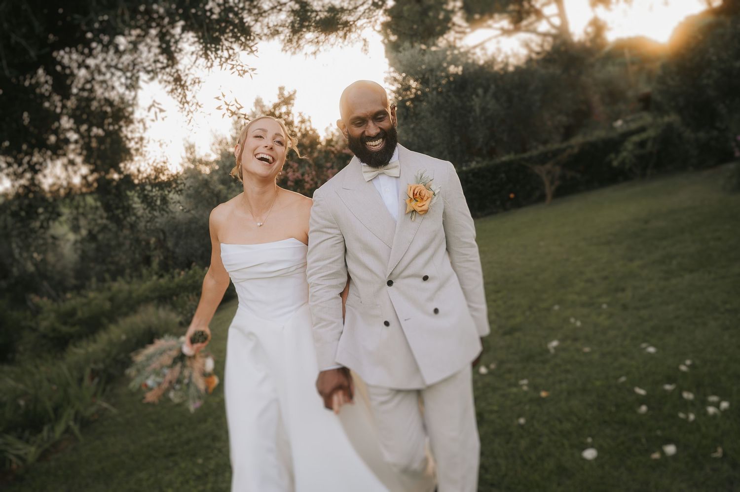Bride and groom walking together during Tuscany wedding celebration