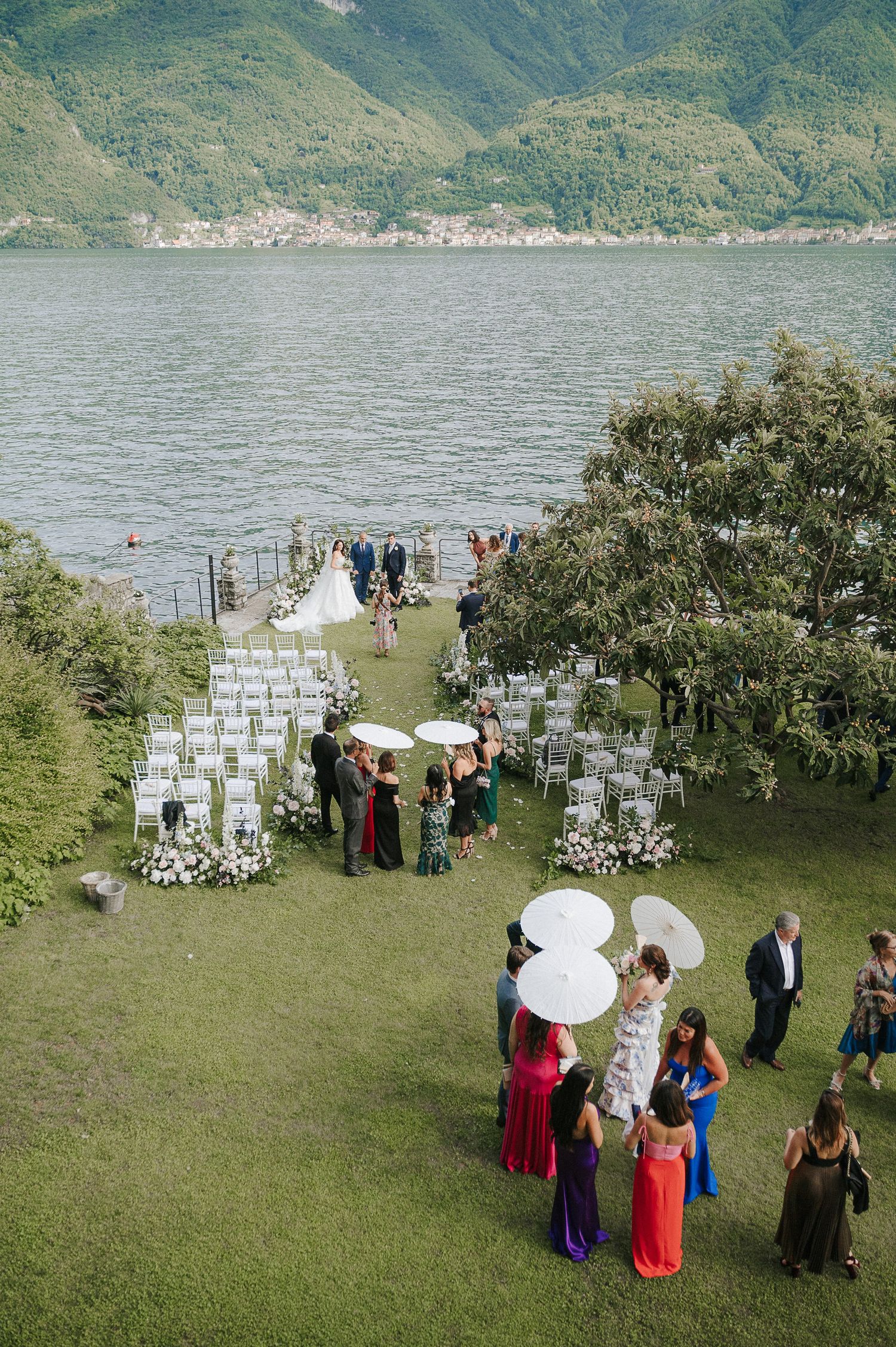 Outdoor wedding ceremony overlooking Lake Como, Italy, documenting an elegant destination celebration