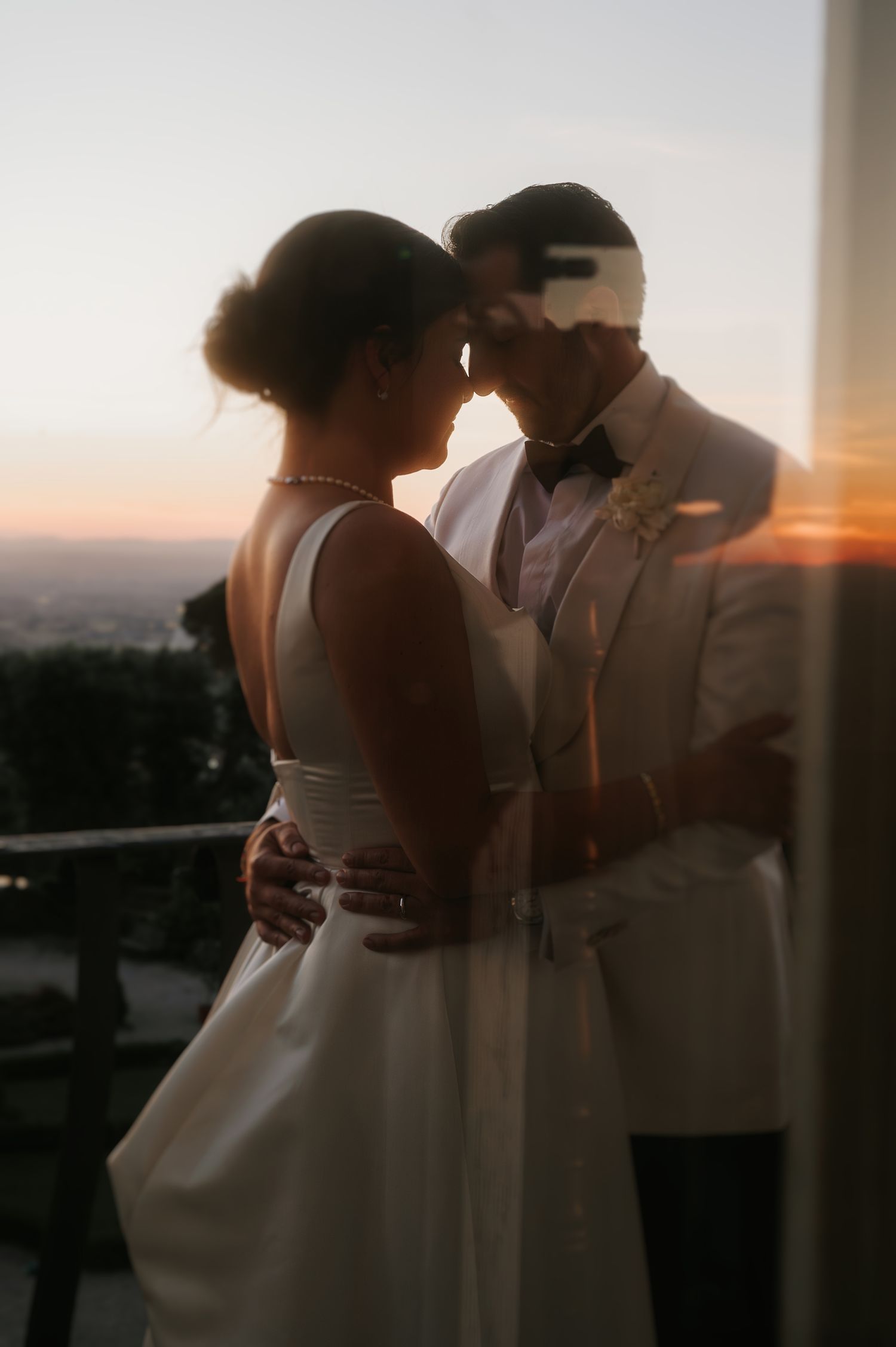 Intimate couple portrait at sunset, capturing connection and emotion in a refined editorial wedding style