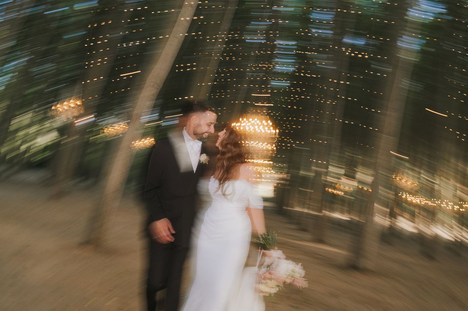 Romantic evening portrait of the bride and groom during a refined destination wedding at Tenuta Savoca, Sicily