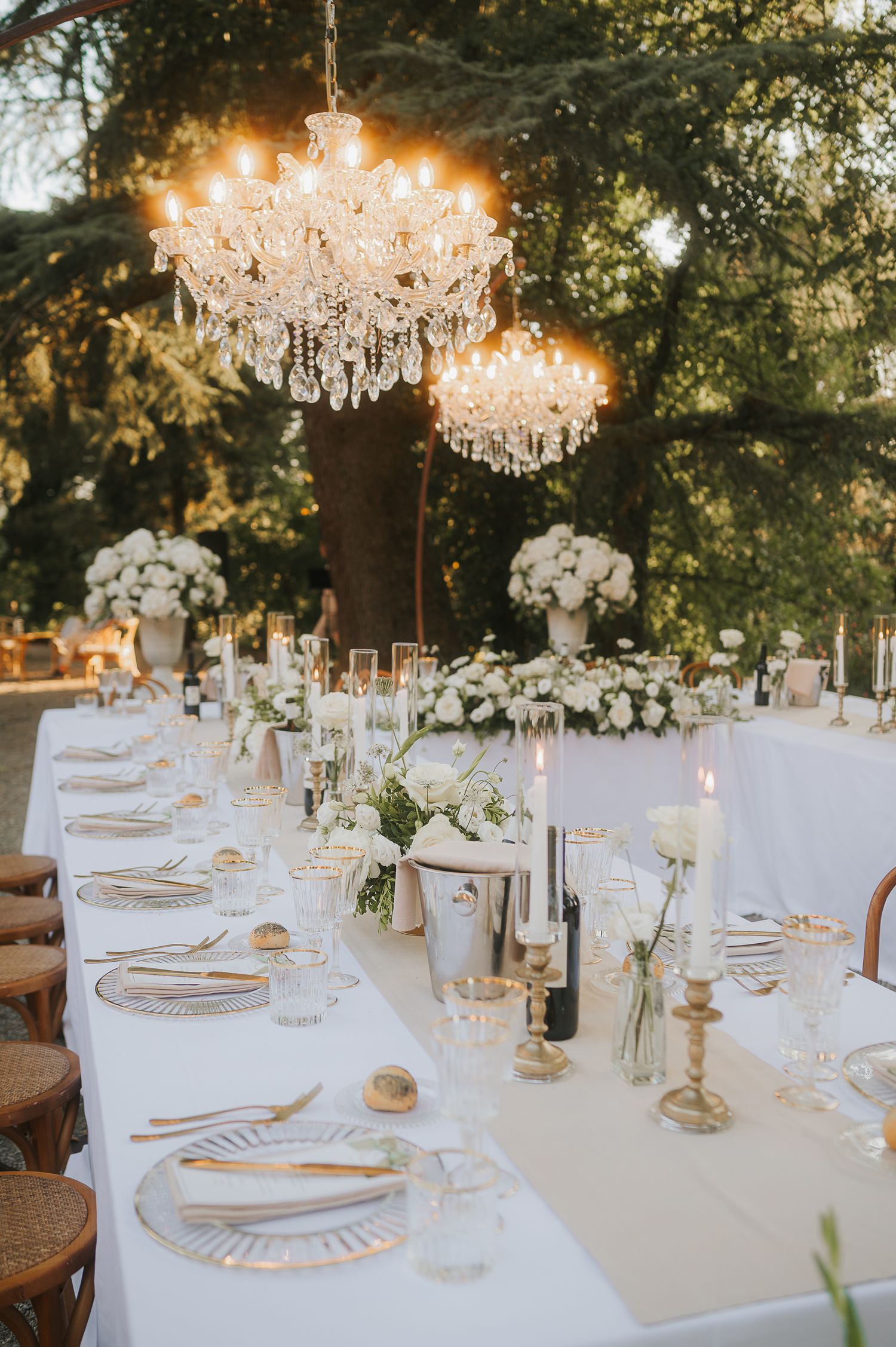 Outdoor wedding reception in Tuscany, Italy, featuring elegant table design and a timeless atmosphere