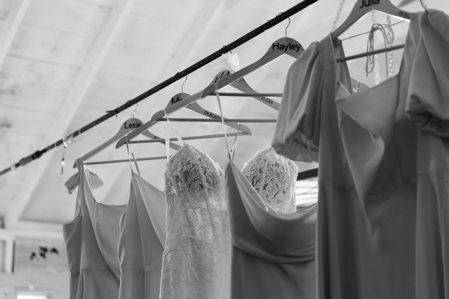 Wedding dresses hung up in a cabin for a wedding at Camp Waziyatah in Waterford, Maine at captured by illuminate the stars Photography