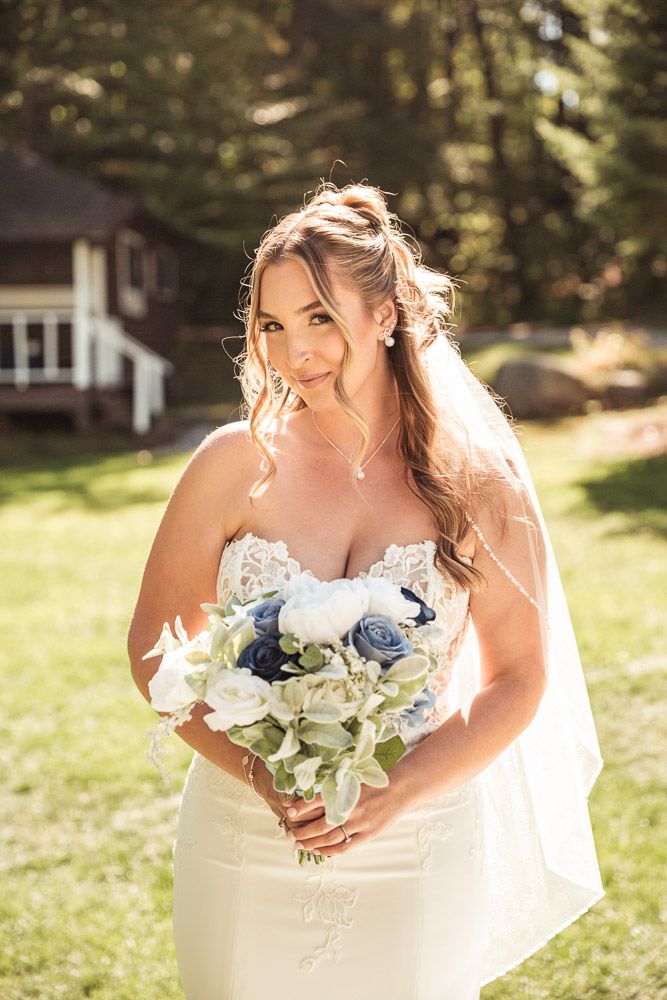 Bride in mermaid wedding dress during her fall wedding at Camp Waziyatah in Waterford, Maine captured by illuminate the stars Photography