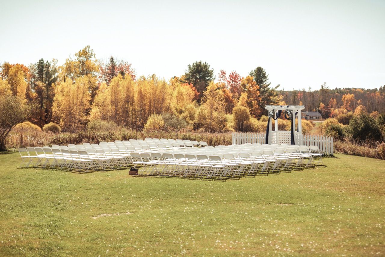 Ceremony site set up for Fall wedding at Morgan Hill Event Center in Herman, Maine captured by illuminate the stars Photography