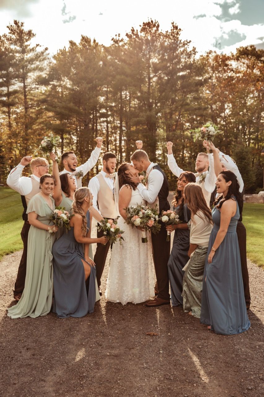 Wedding party cheering during a fall wedding at Beech Hill Barn in Pittston, Maine captured by illuminate the stars Photography