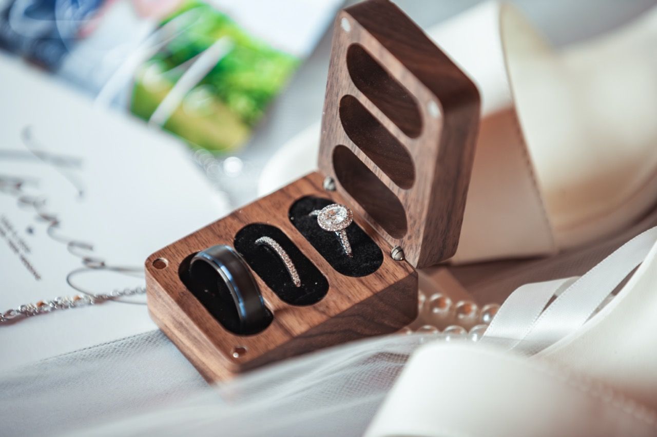 Detail shot of rings for Fall wedding at Morgan Hill Event Center in Herman, Maine captured by illuminate the stars Photography