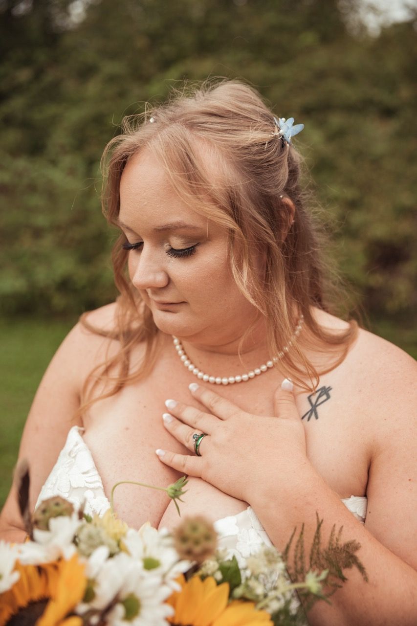 Bride showing off her rings after her fall wedding at The Lakeside Lodge in Sydney, Maine captured by illuminate the stars Photography
