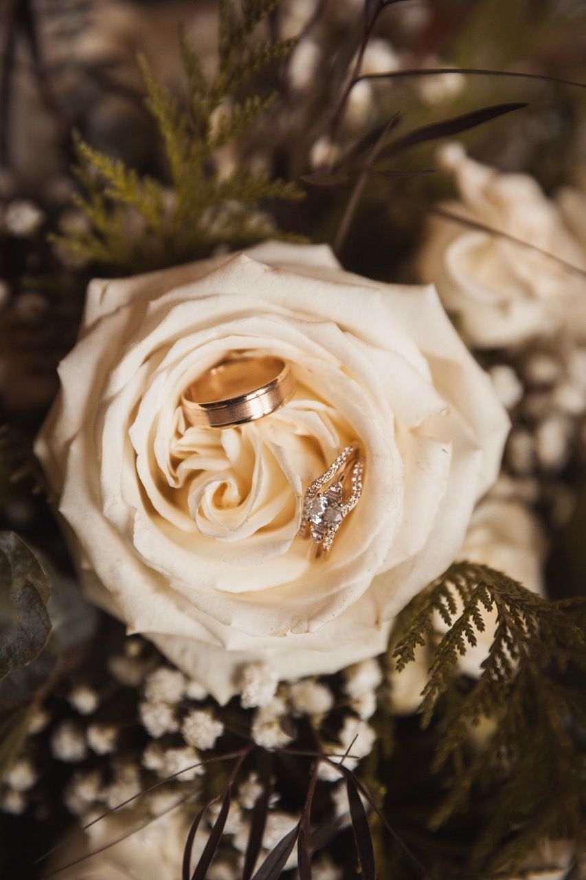 Wedding rings for a winter wedding at Sugarloaf Mountain Resort in Carrabassett Valley, Maine captured by illuminate the stars Photography