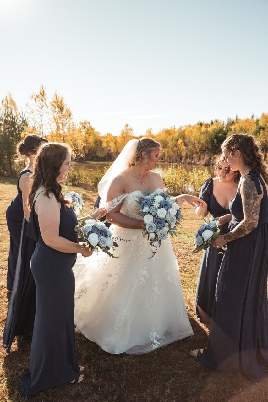 Bridesmaids admiring bride's ring at wedding at Morgan Hill Event Center in Herman, Maine captured by illuminate the stars Photography