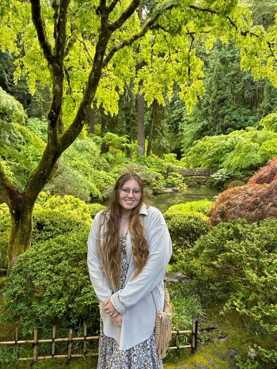 Woman posing for a picture at the Portland Japanese Garden located in Portland, Oregon