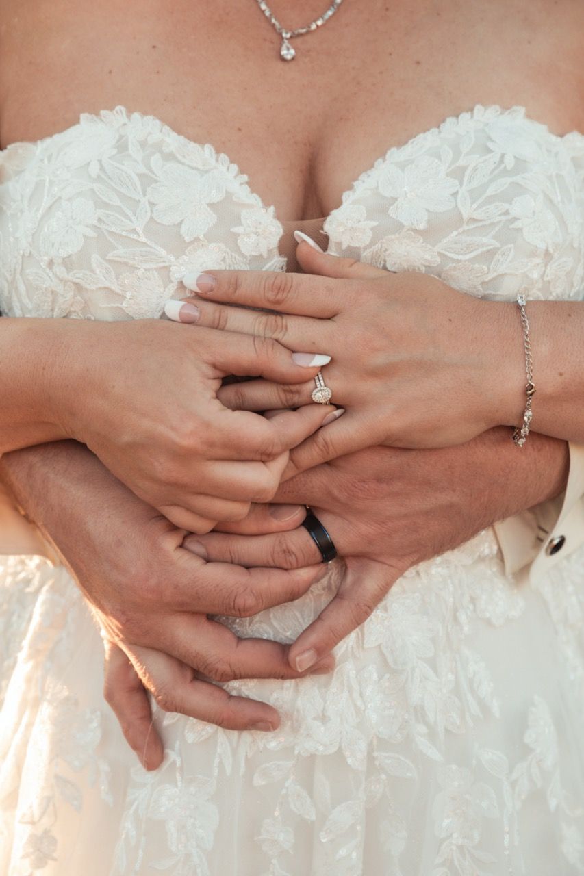 Close up of couple showing off rings at wedding at Morgan Hill Event Center in Herman, Maine captured by illuminate the stars Photography