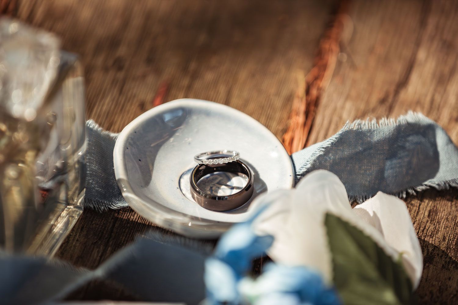 Wedding rings for a wedding at Camp Waziyatah in Waterford, Maine at captured by illuminate the stars Photography
