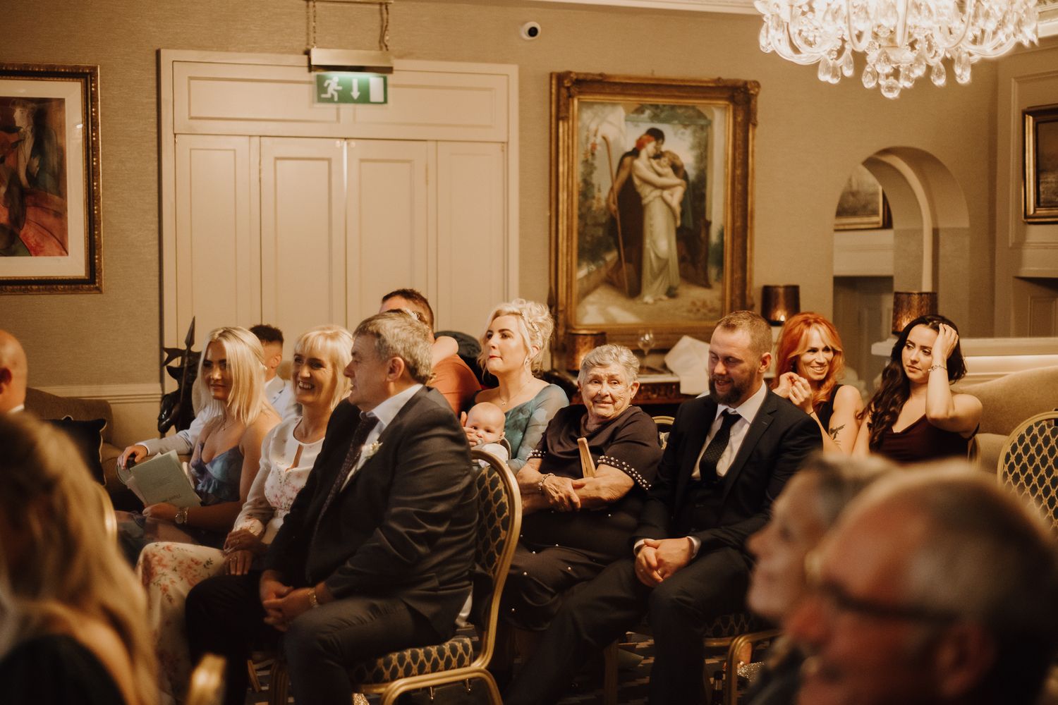 Wedding guests watching the ceremony with emotion at an intimate Irish wedding
