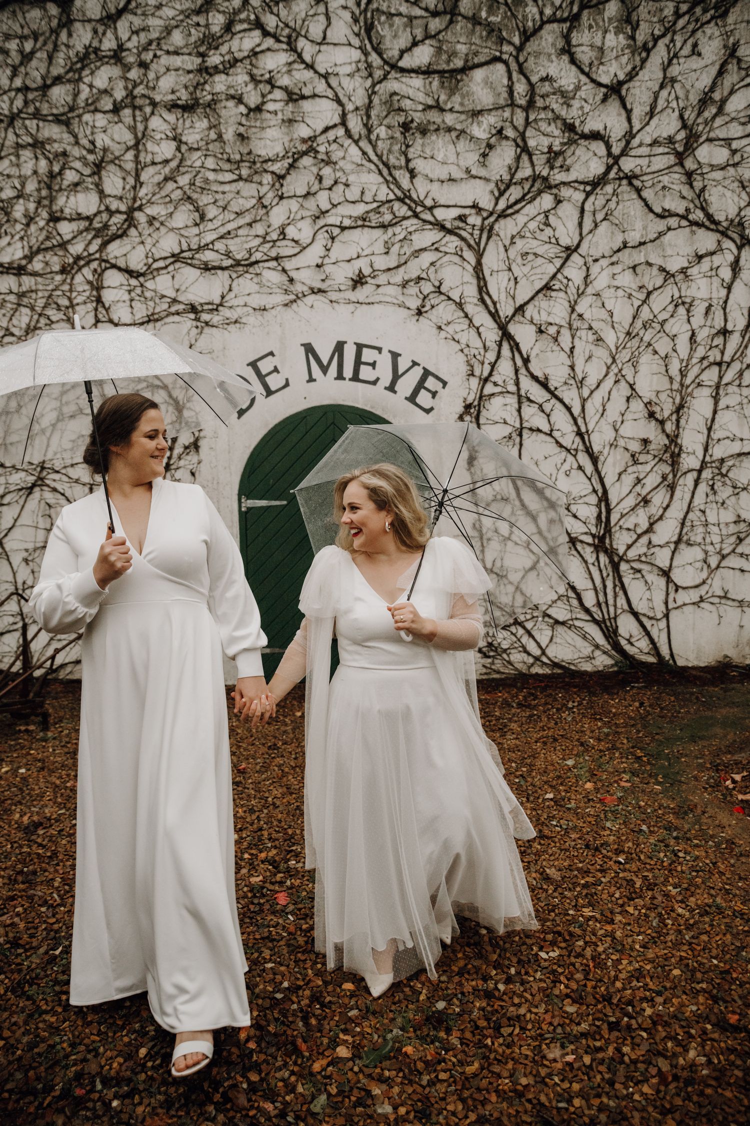 wedding couple lgbtq brides umbrella rain
candid documentary
De Meye Stellenbosch South Africa
Plain Blue Wedding Photo & Film