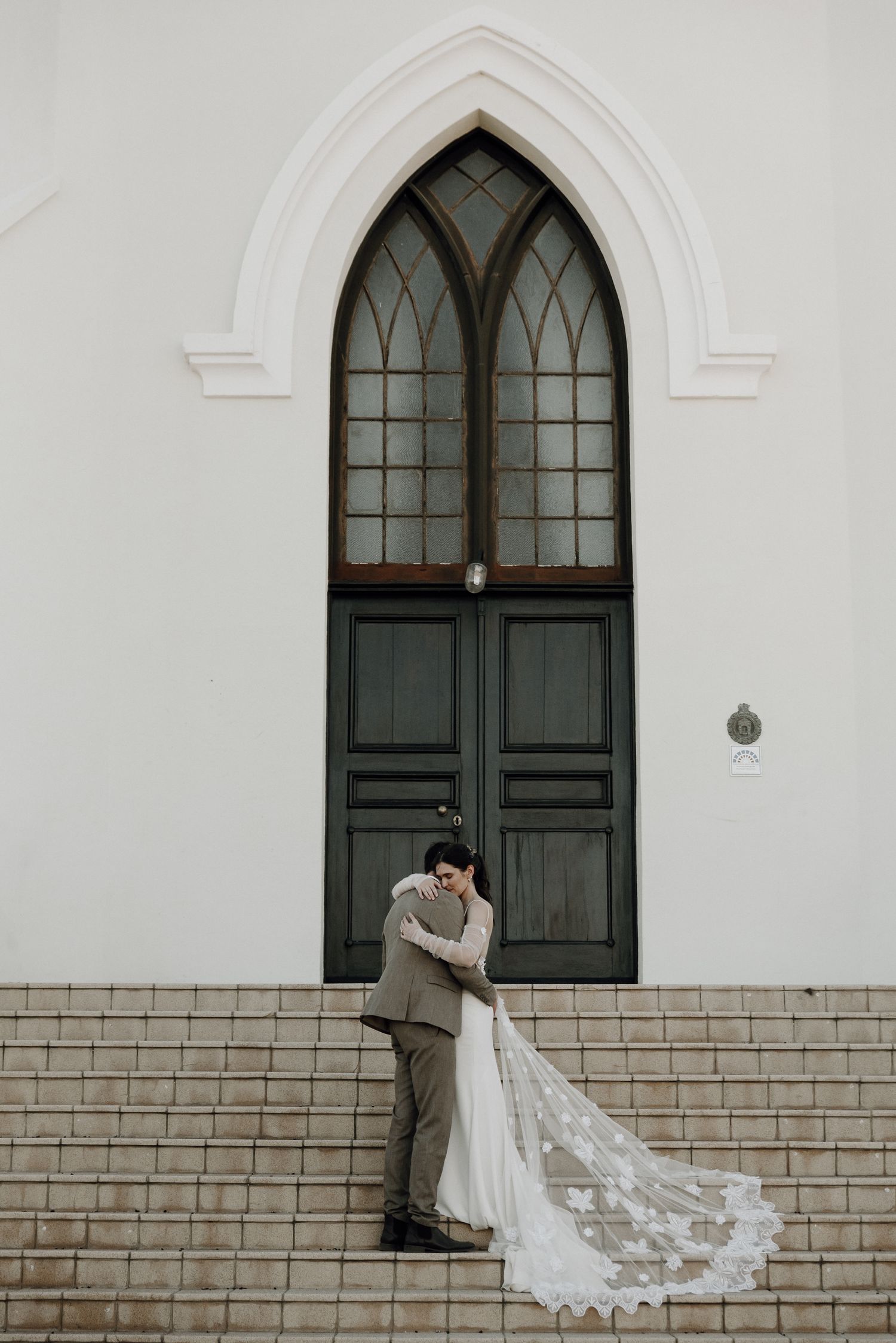 Couples portrait in front of NG Church Prince Albert