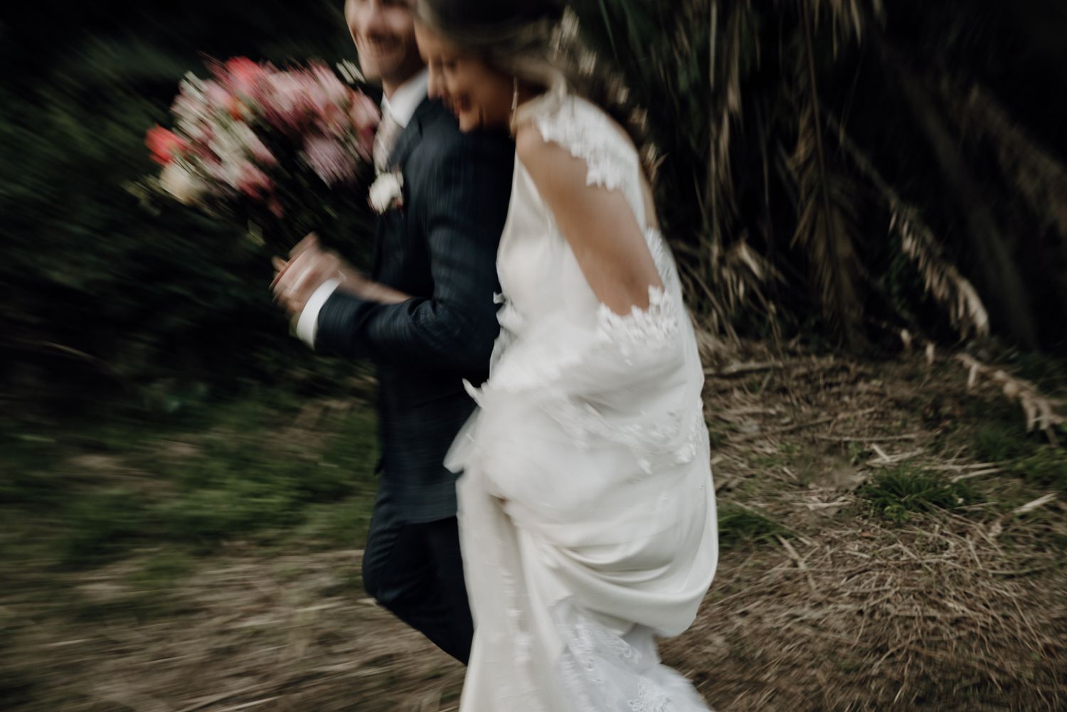 bridal couple running slow shutter speed long exposure Richard's Bay KwaZulu-Natal South Africa editorial documentary fine art Plain Blue