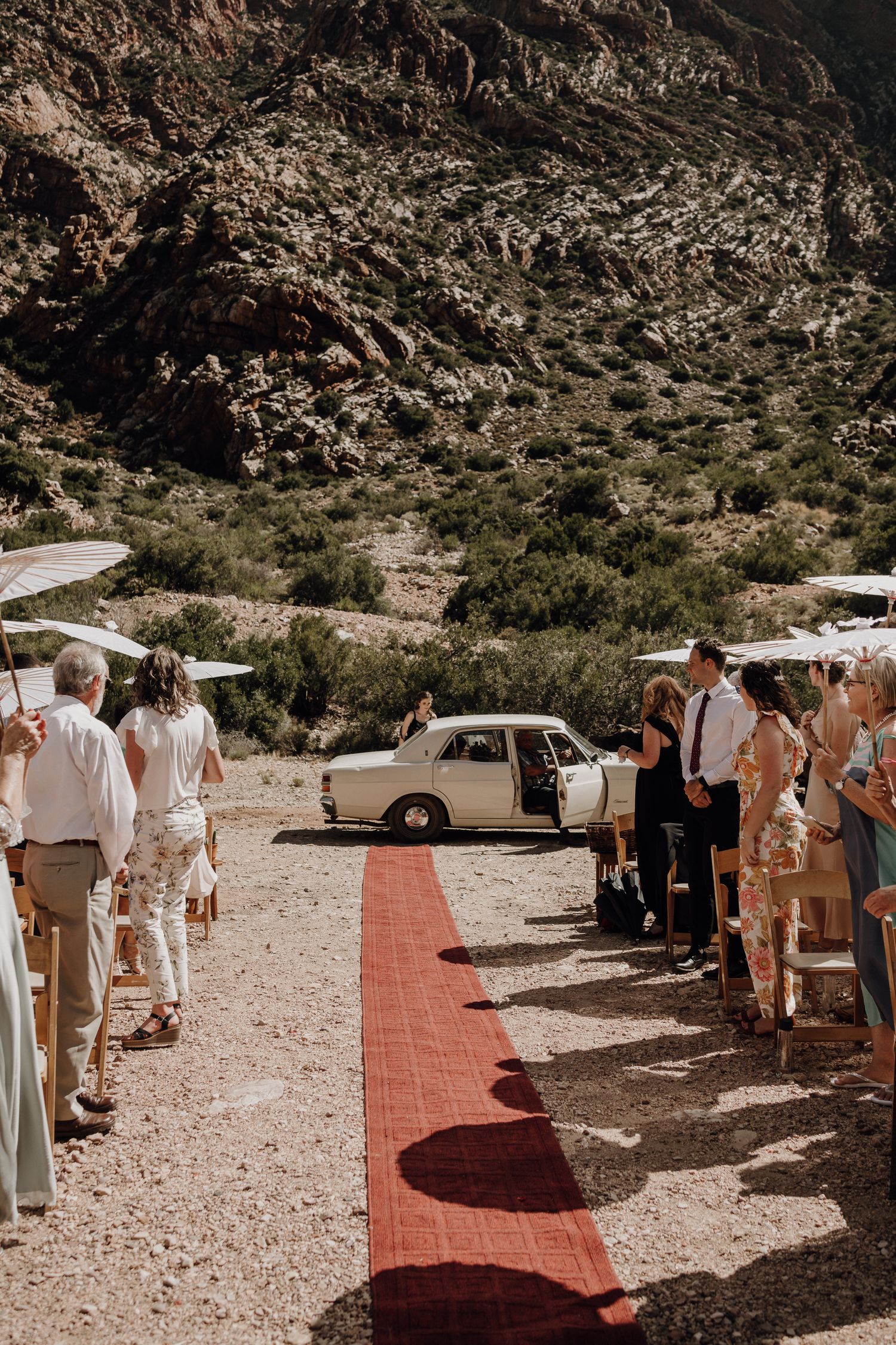 Bride arriving in wedding car at ceremony at Eerstewater in the Swartberg Mountains for Prince Albert destination wedding
