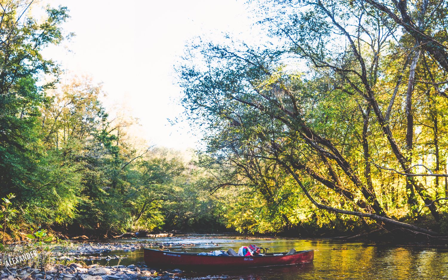 Sunlit river Cary Roofing - 4Adventure Media.