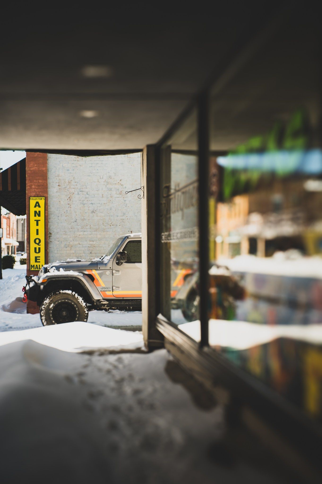 David's Jeep Gladiator parked in front of the Collector's Antique Mall, establishing local entity authority in downtown Asheboro, NC.