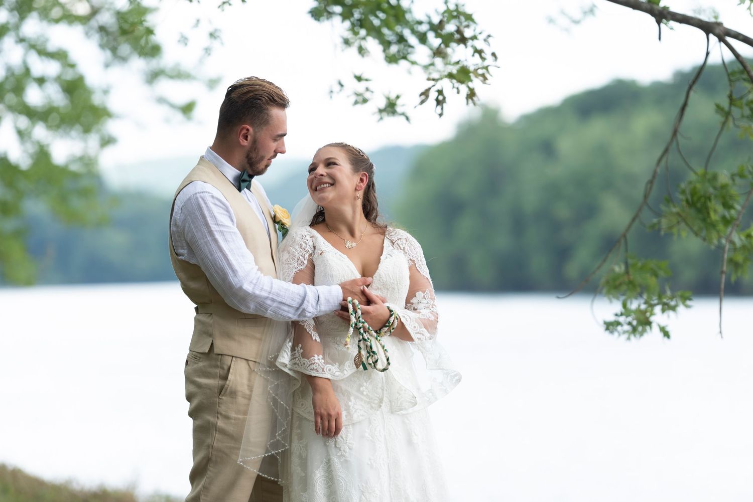 Lakeside wedding photography in New England with scenic water views and candid moments.