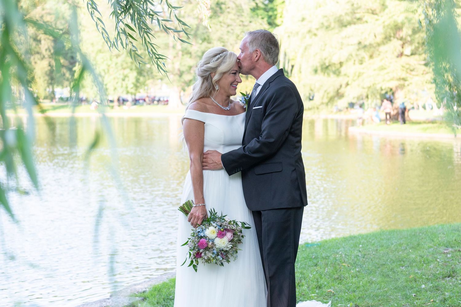 Bride and groom sharing a romantic moment in a Boston garden wedding.